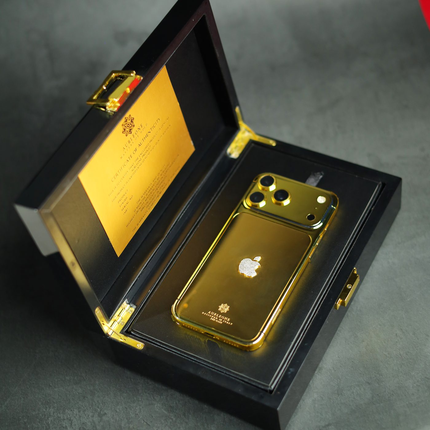 Aurleone gold iPhone 17 Pro in its lacquer presentation box